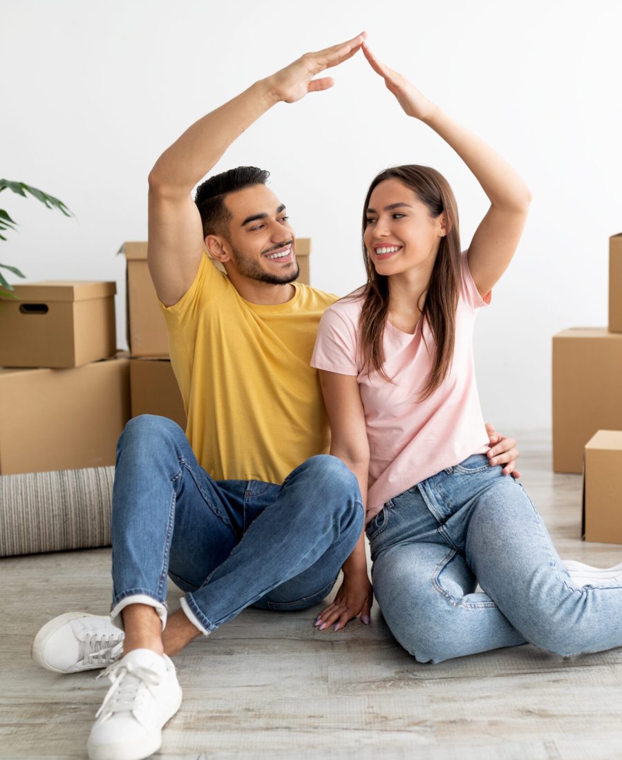 Happy couple with their new home